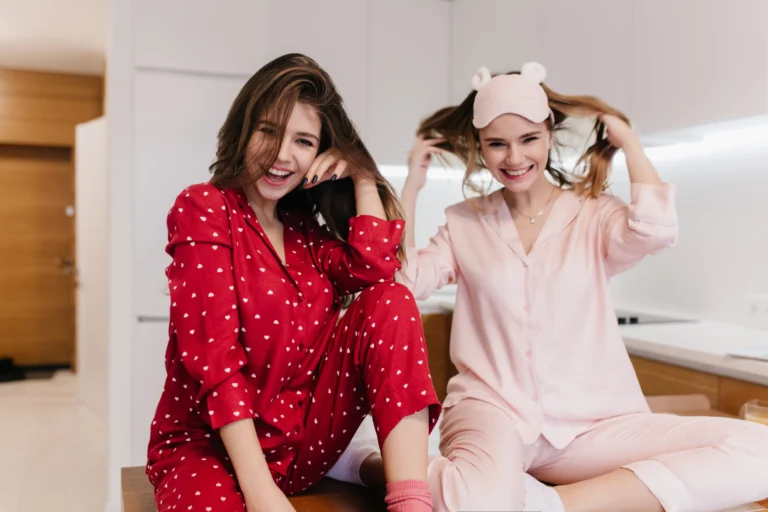 blissful-girl-pink-sleepwear-sitting-with-legs-folded-smiling-indoor-portrait-glad-brunette-lady-red-clothes-posing-kitchen